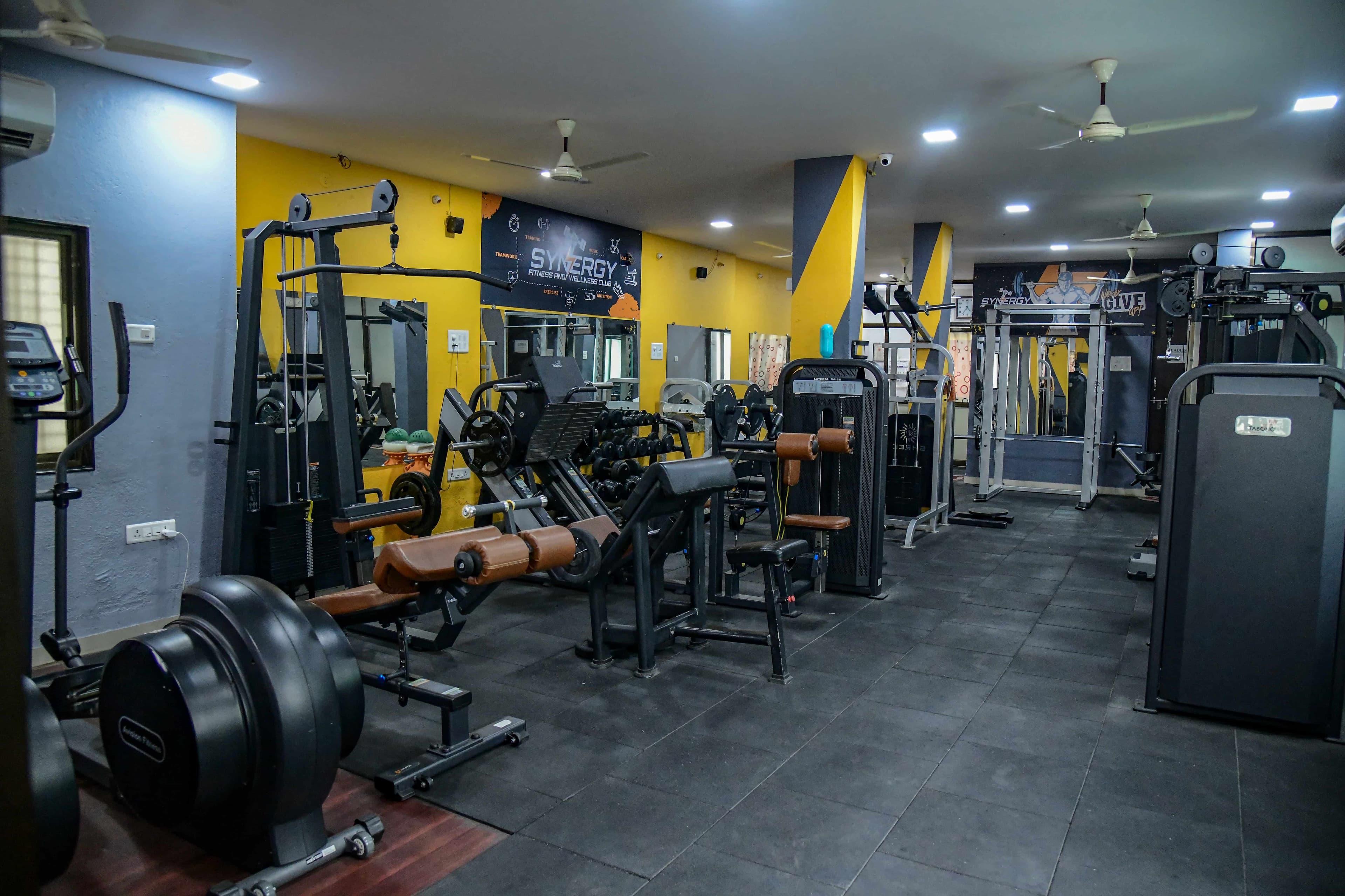 Clean, organised gym interior at Synergy Fitness Akola